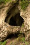 Печерка поруч з невеличким водоспадом